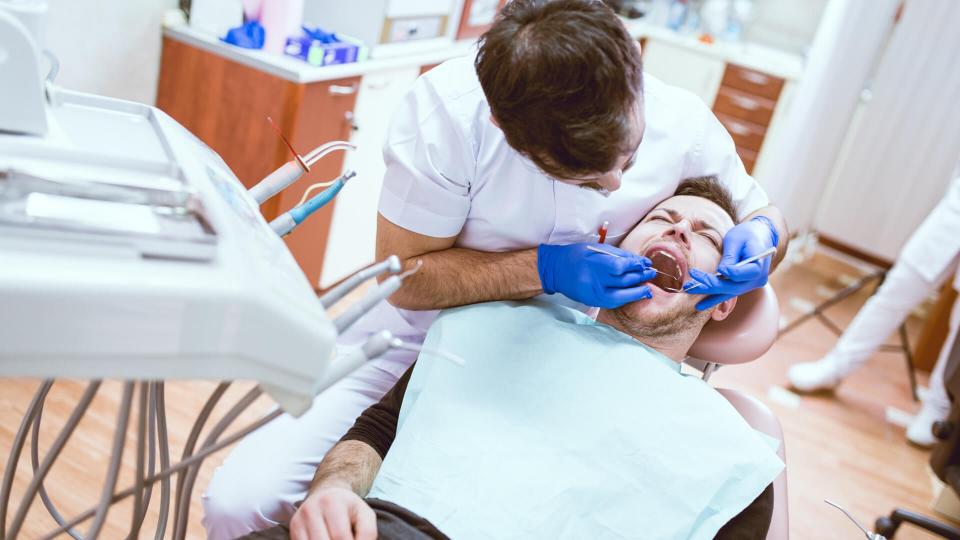 Dentist doing Surgery