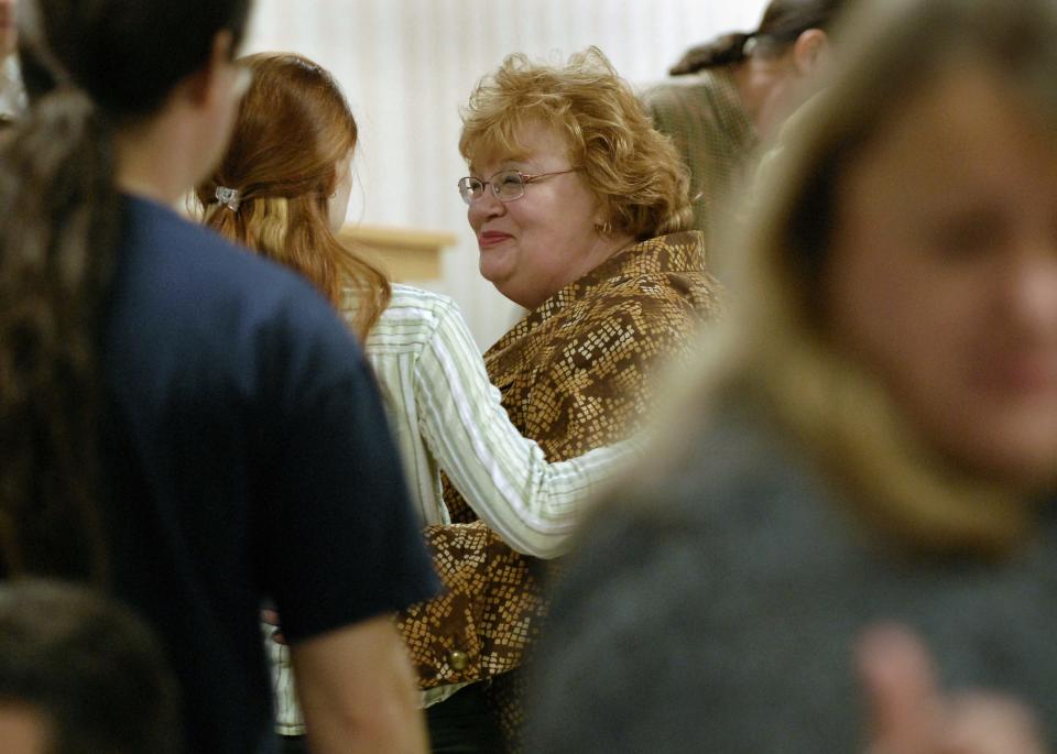 Carol Wood, center right, is surrounded by well-wishers as people gather in Lansing Wednesday 1/30/08 to celebrate the life and legacy of her mother, Ruth Hallman, on what would have been Hallman's birthday. (photo by Rod Sanford)

Photo Gallery