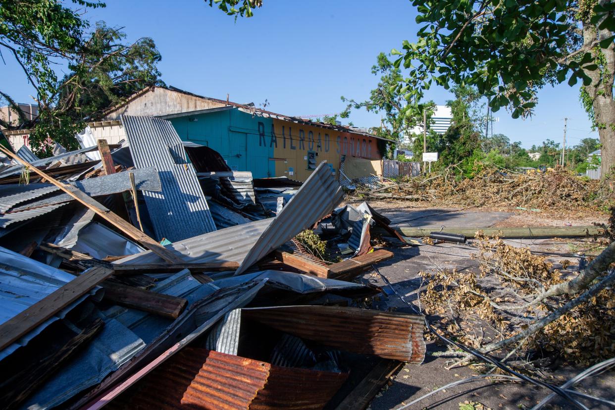 Piles of debris, missing roofs and walls are seen throughout Railroad square in the aftermath of the tornadoes that tore through Tallahassee a week prior.