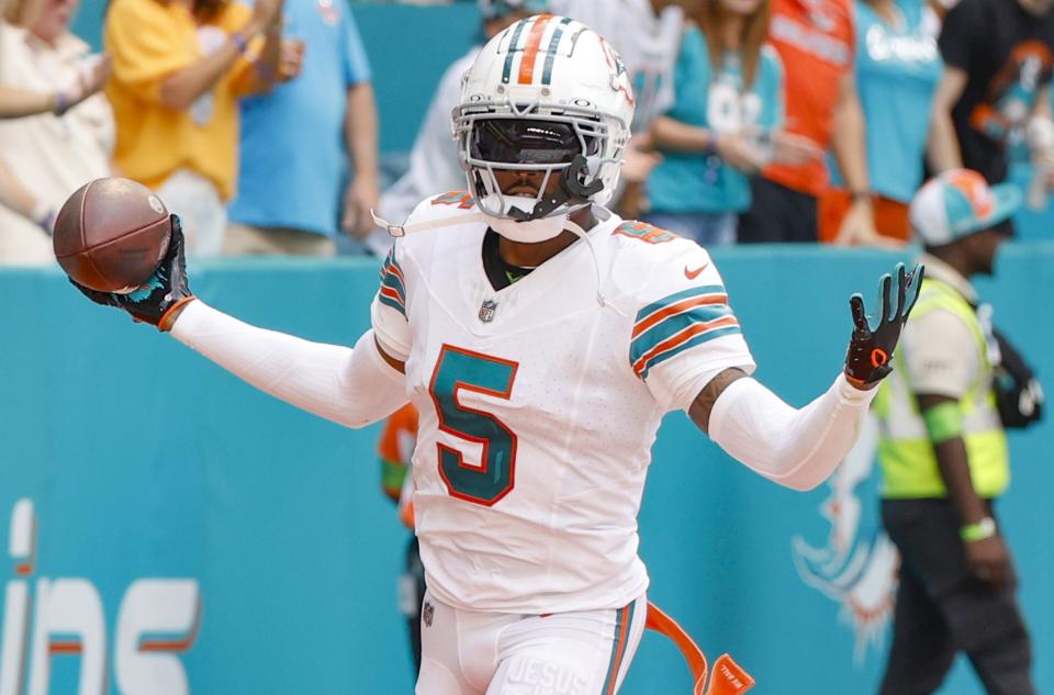 Miami Dolphins cornerback Jalen Ramsey (5) celebrates after intercepting a pass during an NFL football game against the New England Patriots in Miami Gardens, Fla., Sunday, Oct. 29, 2023. (Al Diaz/Miami Herald via AP)