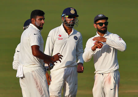 India v England - Second Test cricket match - Dr. Y.S. Rajasekhara Reddy ACA-VDCA Cricket Stadium, Visakhapatnam, India - 20/11/16. India's Virat Kohli (R) asks for the third umpire's decision for the wicket of England's Alastair Cook. REUTERS/Danish Siddiqui