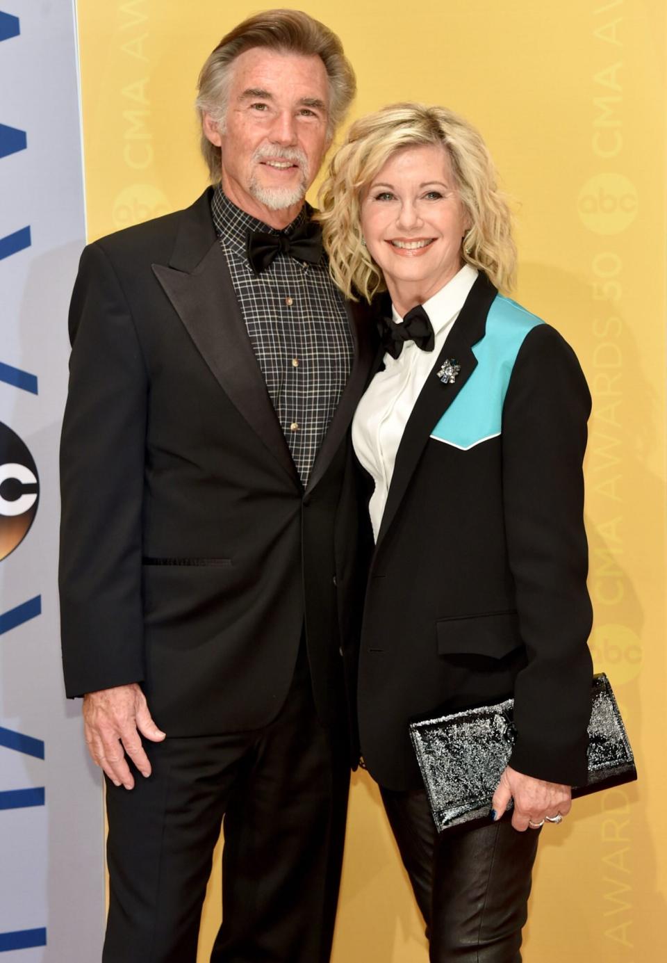 NASHVILLE, TN - NOVEMBER 02: John Easterling (L) and singer Olivia Newton-John (R) attend the 50th annual CMA Awards at the Bridgestone Arena on November 2, 2016 in Nashville, Tennessee. (Photo by John Shearer/WireImage)