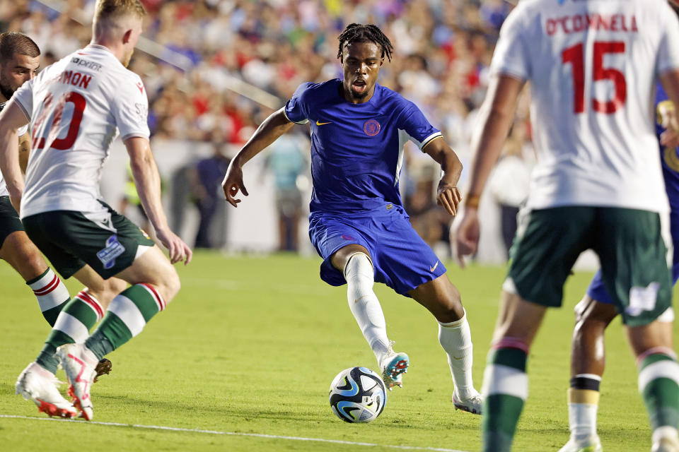 Chelsea's Carney Chukwuemeka, center, controls the ball between Wrexham defenders during the first half of a club friendly soccer match Wednesday, July 19, 2023, in Chapel Hill, N.C. (AP Photo/Karl B DeBlaker)