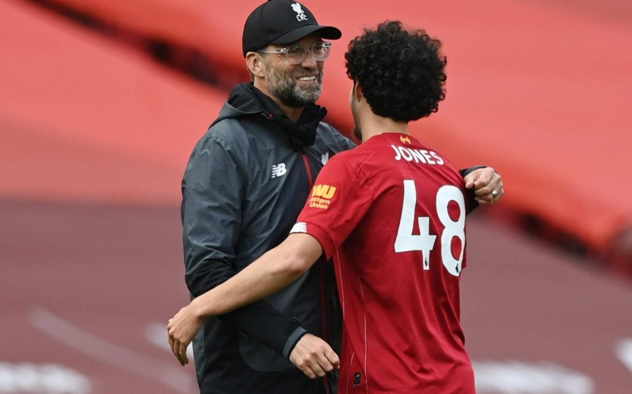 Liverpool's Curtis Jones celebrates with manager Juergen Klopp - REUTERS