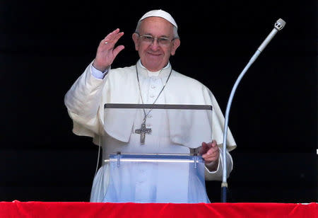 FILE PHOTO: Pope Francis waves as he arrives to lead the Regina Caeli prayer in Saint Peter's Square at the Vatican on April 17, 2017. REUTERS/Max Rossi/File Photo