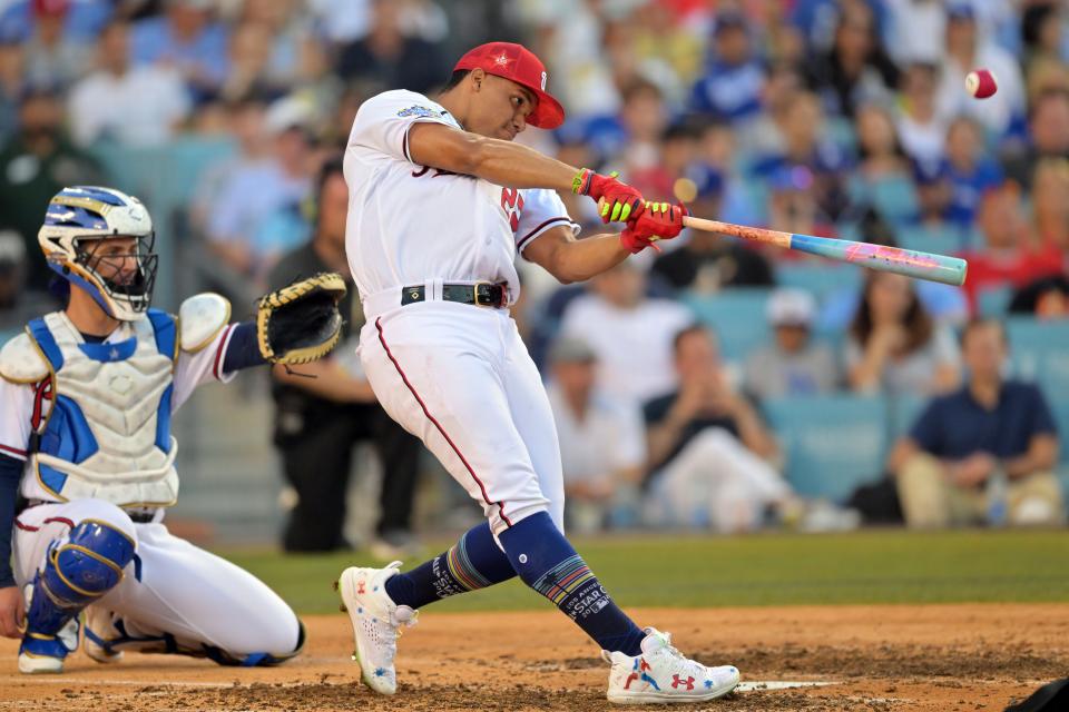 The Washington Nationals' Juan Soto hits in the final round against the Seattle Mariners' Julio Rodriguez.