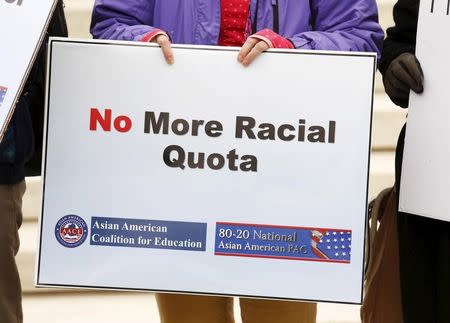 FILE PHOTO: Asian-American demonstrators protest outside the Supreme Court as the affirmative action in university admissions case was being heard by the court in Washington, December 9, 2015. REUTERS/Kevin Lamarque