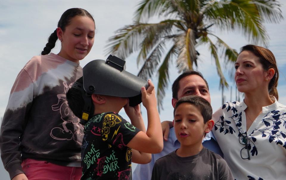 People watch the total solar eclipse in Mazatlan, Mexico