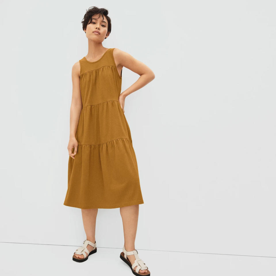 Model wears The Weekend Tiered Dress in tan. Image via Everlane.