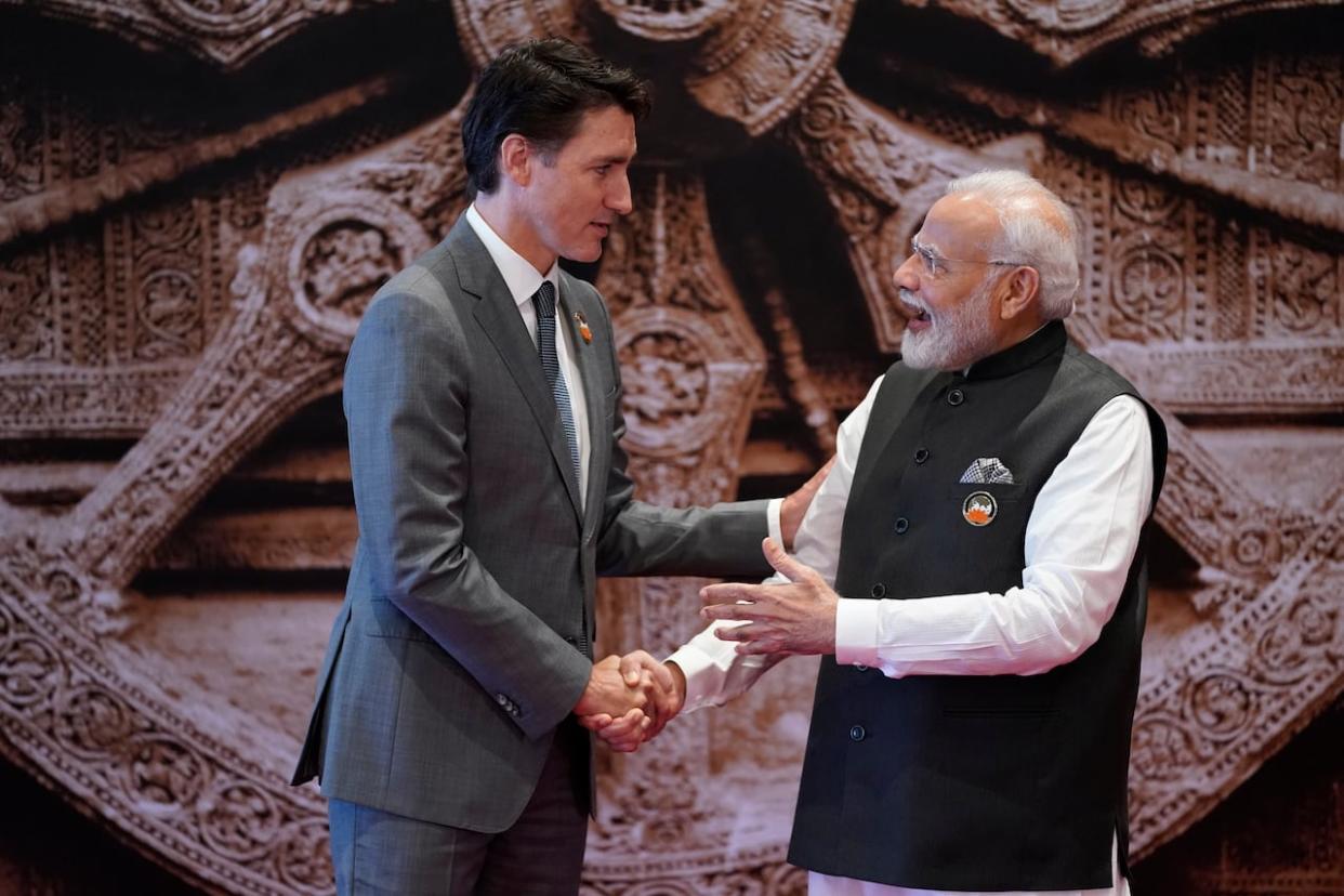 Indian Prime Minister Narendra Modi welcomes Prime Minister Justin Trudeau upon his arrival at Bharat Mandapam convention center for the G20 Summit in New Delhi on Sept. 9. (Evan Vucci/Associated Press - image credit)