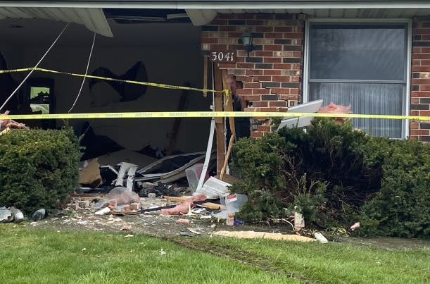 PHOTOS: Car crashes into Springfield living room