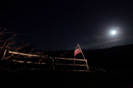 An America flag is seen after Hurricane Maria hit San Lorenzo, Morovis, Puerto Rico, October 4, 2017. REUTERS/Alvin Baez