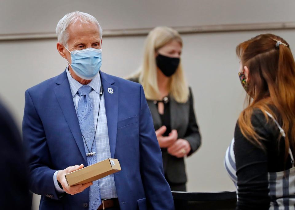 Rep. Bob Behning and other representatives gather as the Indiana House meets, Thursday, Jan. 7, 2021, in its temporary chamber at the Government Center South in Indianapolis.