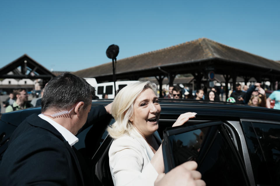 French far-right leader Marine Le Pen leaves after a campaign stop in Saint-Remy-sur-Avre, western France, Saturday, April 16, 2022. Marine Le Pen is trying to unseat centrist President Emmanuel Macron, who has a slim lead in polls ahead of France's April 24 presidential runoff election. (AP Photo/Thibault Camus)