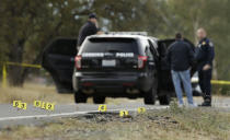 <p>Yellow tags mark where bullet casings found at one of the scenes of a shooting spree at Rancho Tehama Reserve, near Corning, Calif., Nov. 14, 2017. (Photo: Rich Pedroncelli/AP) </p>