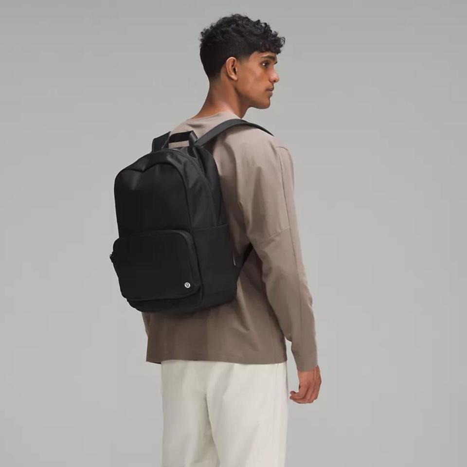 model wearing black everywhere backpack