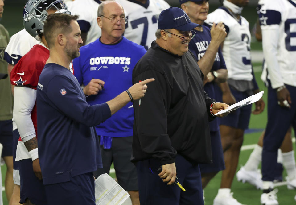 Dallas Cowboys offensive coordinator Brian Schottenheimer and head coach Mike McCarthy look on during an NFL football practice, Tuesday, June 6, 2023, in Frisco, Texas. (AP Photo/Richard W. Rodriguez)