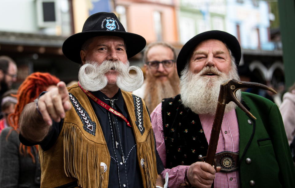 A participant and competitor Fritz Sendlhofer (R) from Austria attends the German Moustache and Beard Championships 2021 at Pullman City Western Theme Park in Eging am See, Germany, October 23, 2021. REUTERS/Lukas Barth