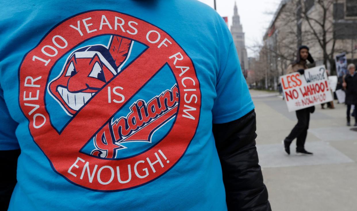 A man wears a shirt calling on Cleveland's baseball franchise to change its logo and name at a 2018 protest outside the team's stadium. (Photo: (AP Photo/Tony Dejak))