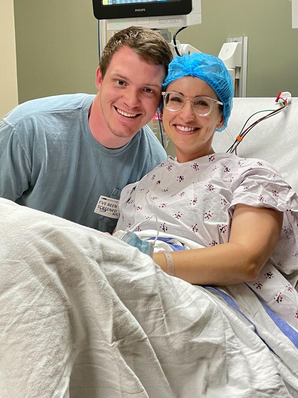 a man and a woman in a hospital bed