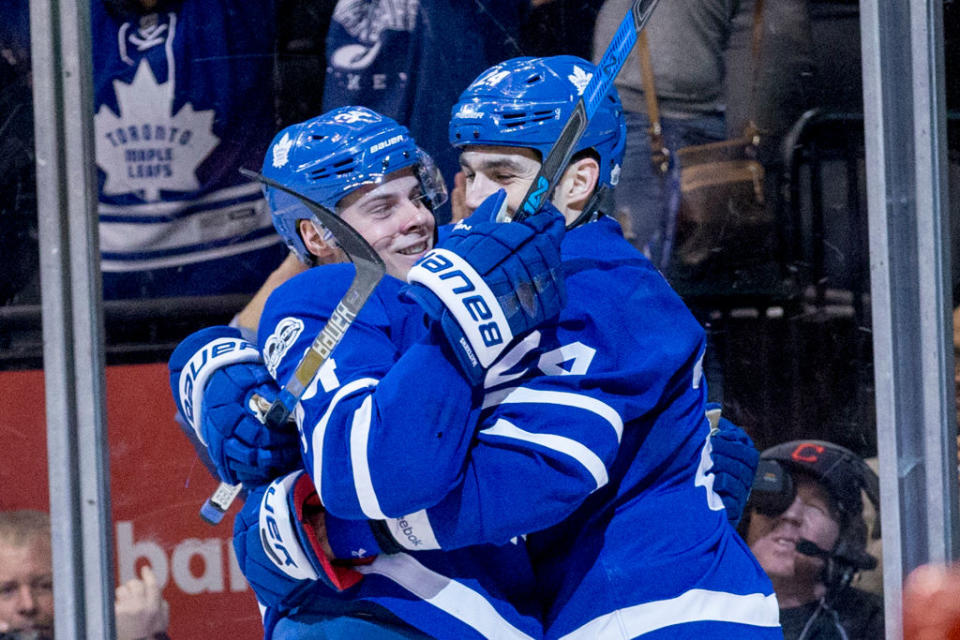 TORONTO, ON – APRIL 8 – Auston Matthews of the Toronto Maple Leafs (left) celebrates his empty net goal with Brian Boyle during the 3rd period of NHL action as the Toronto Maple Leafs defeat the Pittsburgh Penguins at the Air Canada Centre 5-3 on April 8, 2017. (Carlos Osorio/Toronto Star via Getty Images)