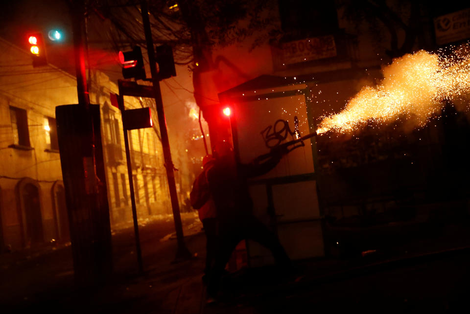 A weapon is fired during clashes between government supporters and protesters against Bolivia's President Evo Morales in La Paz, Bolivia Nov. 7, 2019. (Photo: Kai Pfaffenbach/Reuters)