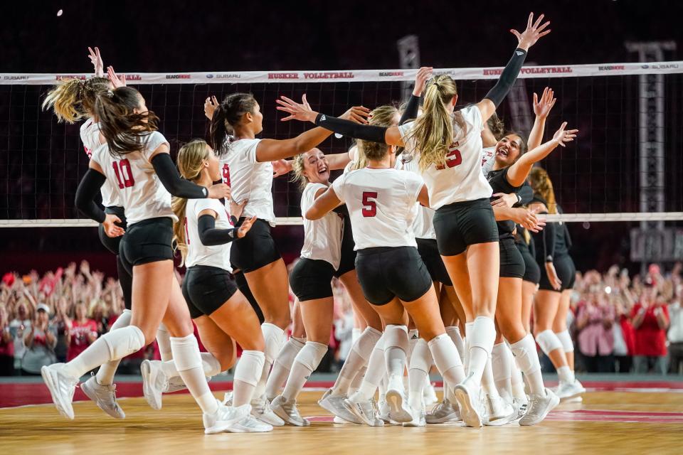 The Nebraska Cornhuskers celebrate after defeating the Omaha Mavericks in three sets at Memorial Stadium.