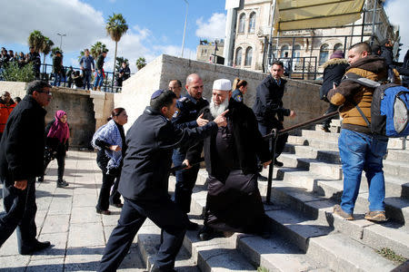 Israeli policemen argue with a Palestinian man during a protest following U.S. President Donald Trump's announcement that he has recognized Jerusalem as Israel's capital, near Damascus Gate in Jerusalem's Old City December 7, 2017. REUTERS/Ammar Awad