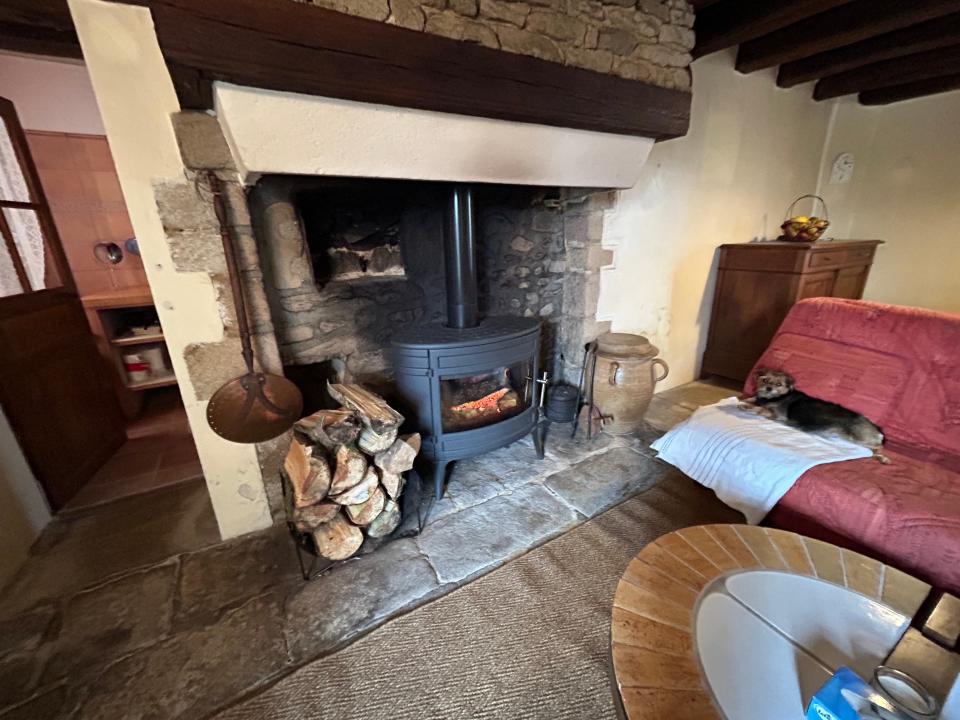 An alternate view of the living room and fireplace.