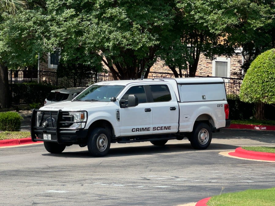 Crime scene investigators leaving the complex on Monday (KXAN Photo/Matt Grant)