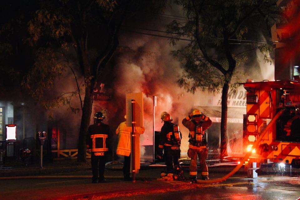 Vancouver firefighters, pictured here at the scene of an October fire in Kerrisdale, will soon begin to get new equipment that doesn't contain a class of chemicals linked to increased cancer rates, according to Chief Karen Fry. (Submitted by Ruvé Staneke - image credit)