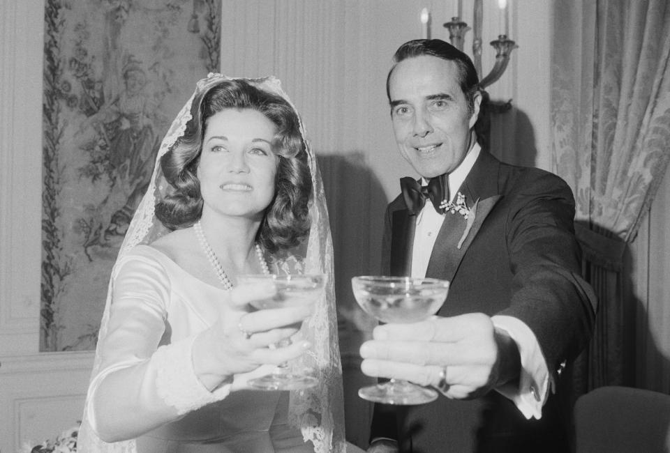 Elizabeth and Bob Dole give a toast on their wedding day.
