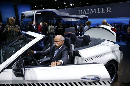 Daimler CEO Dieter Zetsche poses in the Mercedes Maybach 6 car before the Daimler annual shareholder meeting in Berlin, Germany, March 29, 2017. REUTERS/Hannibal Hanschke