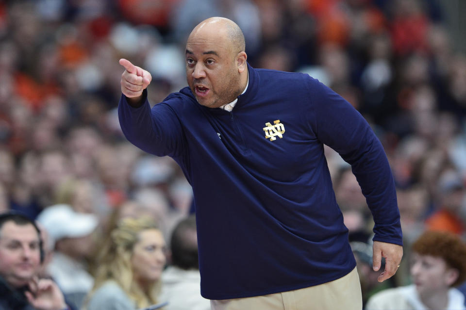 Notre Dame head coach Micah Shrewsberry gestures during the first half of an NCAA college basketball game against Syracuse in Syracuse, N.Y., Saturday, Feb. 24, 2024. (AP Photo/Adrian Kraus)