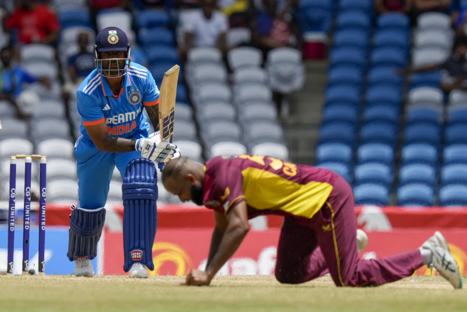 India's Suryakumar Yadav plays a shot from a delivery of West Indies' Yannic Cariah, right, during the third ODI cricket match at the Brian Lara Stadium in Tarouba, Trinidad and Tobago, Tuesday, Aug. 1, 2023. (AP Photo/Ramon Espinosa)