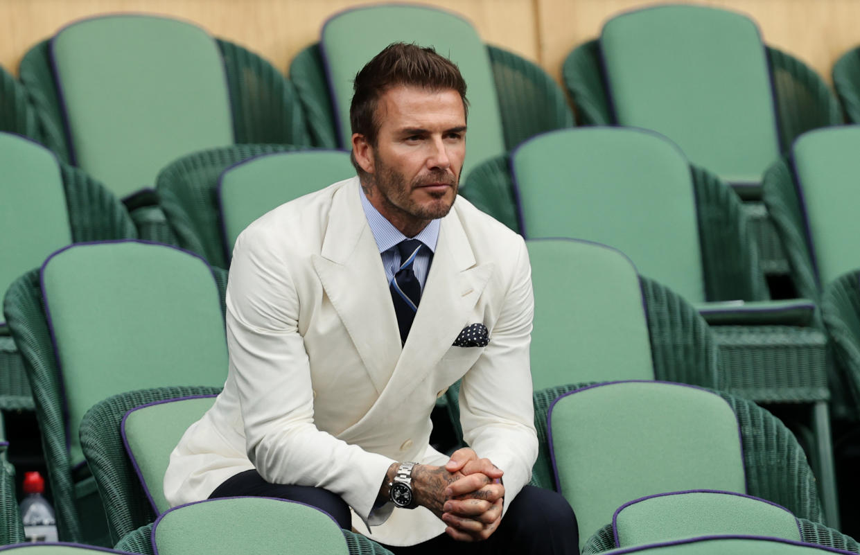 David Beckham, photographed at Wimbledon in July, jokingly pleads with his daughter Harper to 