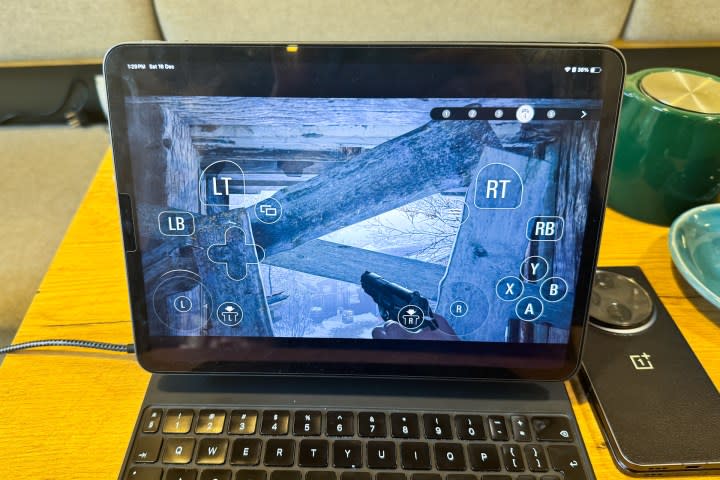 On-screen controls in Resident Evil Village on iPad Pro.