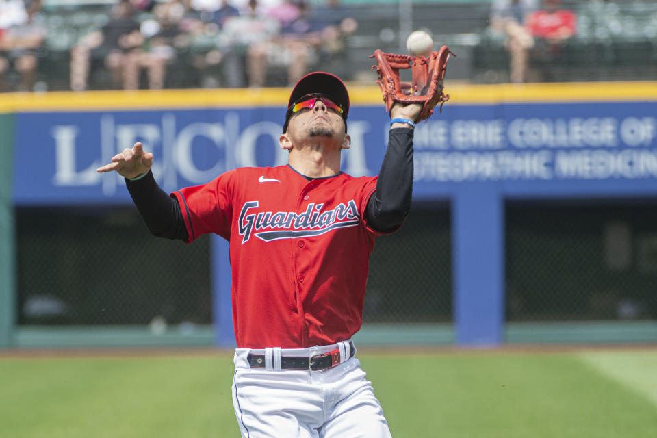 Cleveland Guardians' Andres Gimenez catches a pop-fly hit by Chicago White Sox' Andrew Vaughn during the fifth inning of a baseball game in Cleveland, Wednesday, May 24, 2023. (AP Photo/Phil Long)