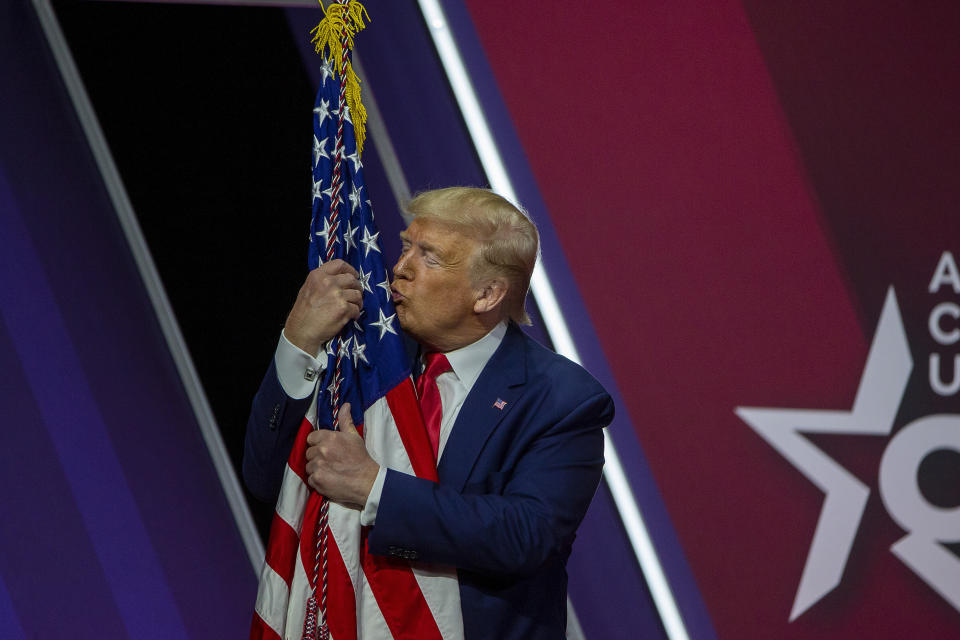 Trump kisses the U.S. flag at the annual Conservative Political Action Conference in National Harbor, Maryland, on Feb. 29, 2020. (Photo: Tasos Katopodis via Getty Images)