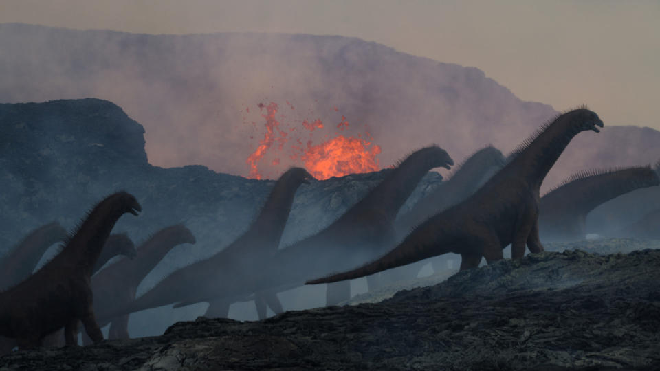 Some Isisaurus from Prehistoric Planet 2, with a volcano in the background