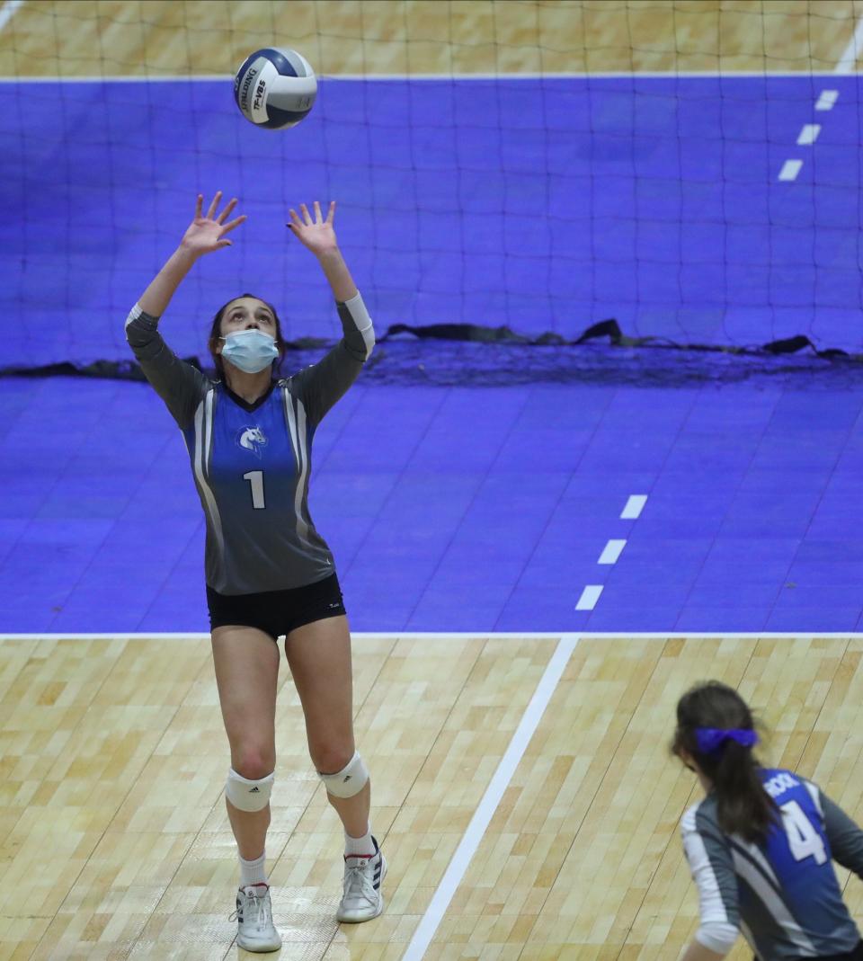 Millbrook's Marisa Markou (1) with a set during pool play action in the NYSPHSAA girls volleyball championships at Cool Insuring Arena in Glens Falls on Saturday, November 20, 2021.