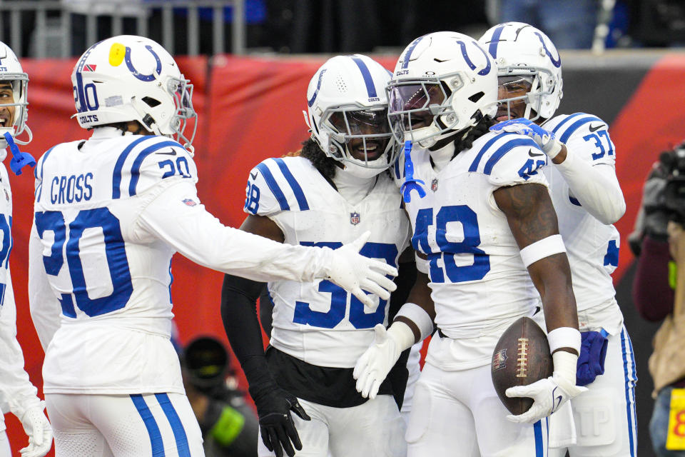 Indianapolis Colts linebacker Ronnie Harrison Jr. (48) celebrates after a touchdown on an interception against the Cincinnati Bengals in the first half of an NFL football game in Cincinnati, Sunday, Dec. 10, 2023. (AP Photo/Jeff Dean)
