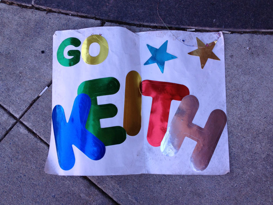 A marathon spectator's homemade sign lays discarded on the sidewalk near the site of the bombings, Boston, April 17, 2013. (Credit: Dylan Stableford)