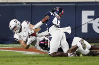 Mississippi State wide receiver Austin Williams (85) lunges past Mississippi defenders to catch a 7-yard touchdown pass during the second half of an NCAA college football game, Saturday, Nov. 28, 2020, in Oxford, Miss. (AP Photo/Rogelio V. Solis)