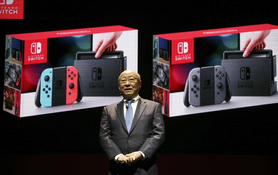 President of Nintendo Tatsumi Kimishima speaks during a presentation event of the new Nintendo Switch in Tokyo, Friday, Jan. 13, 2017. Nintendo Co. said Friday that its Nintendo Switch video game console will sell for 29,980 yen (about $260) in Japan, starting March 3. (AP Photo/Koji Sasahara)