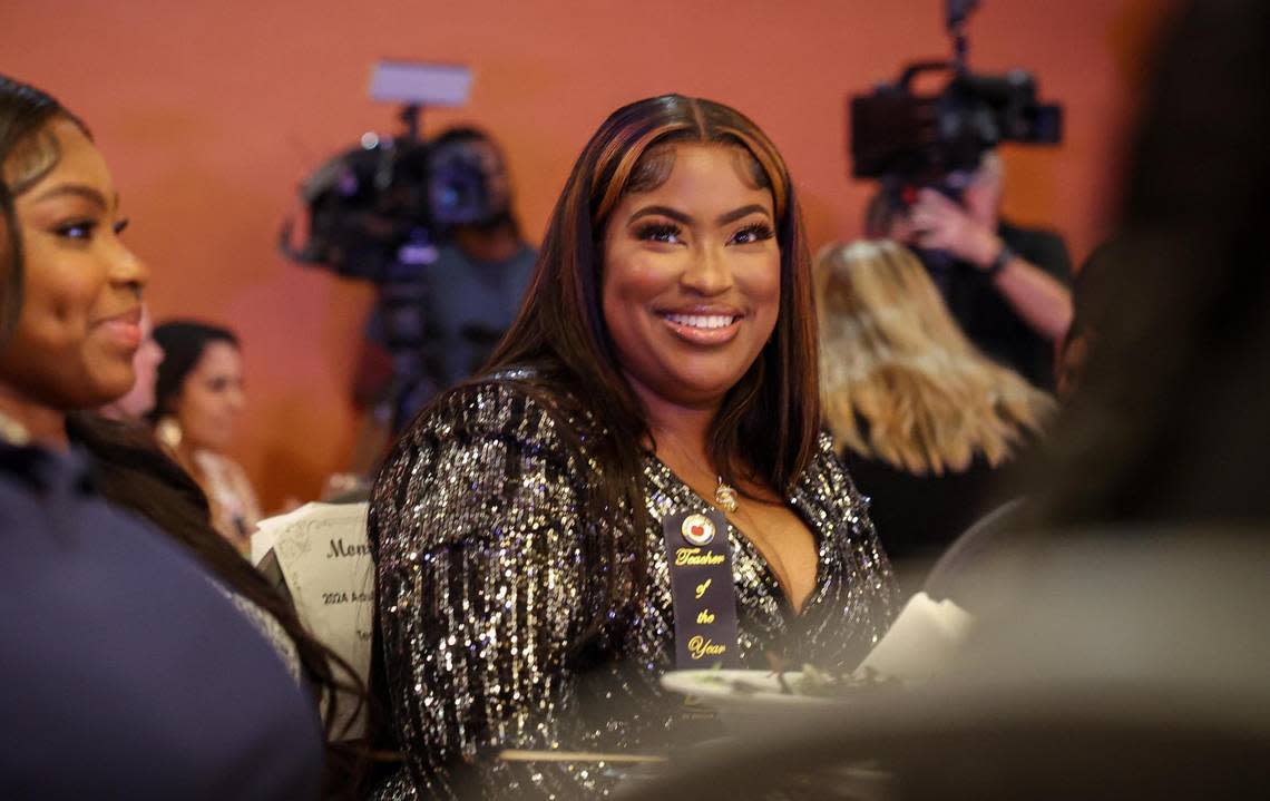 Monique Bryant-Clayton, right, is runner-up for the 2024​ Francisco R. Walker Teacher of the Year for Miami-Dade County Public Schools. She is a teacher at the C.O.P.E Center North and is sitting with her daughter Yahnae Laing during the ceremony Tuesday, Jan. 31, 2023, at the DoubleTree by Hilton Hotel Miami Airport and Convention Center.