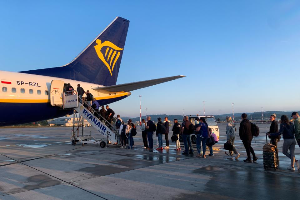 Passenger boarding Ryanair flight in Poland in July 2023.