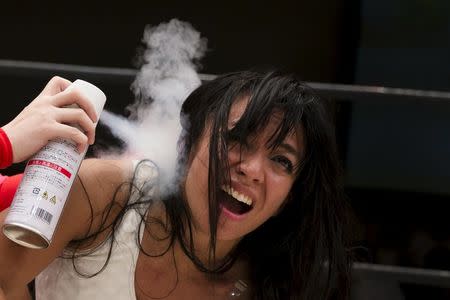 Wrestler Kris Wolf receives ice spray treatment during her Stardom professional wrestling show at Korakuen Hall in Tokyo, Japan, July 26, 2015. REUTERS/Thomas Peter