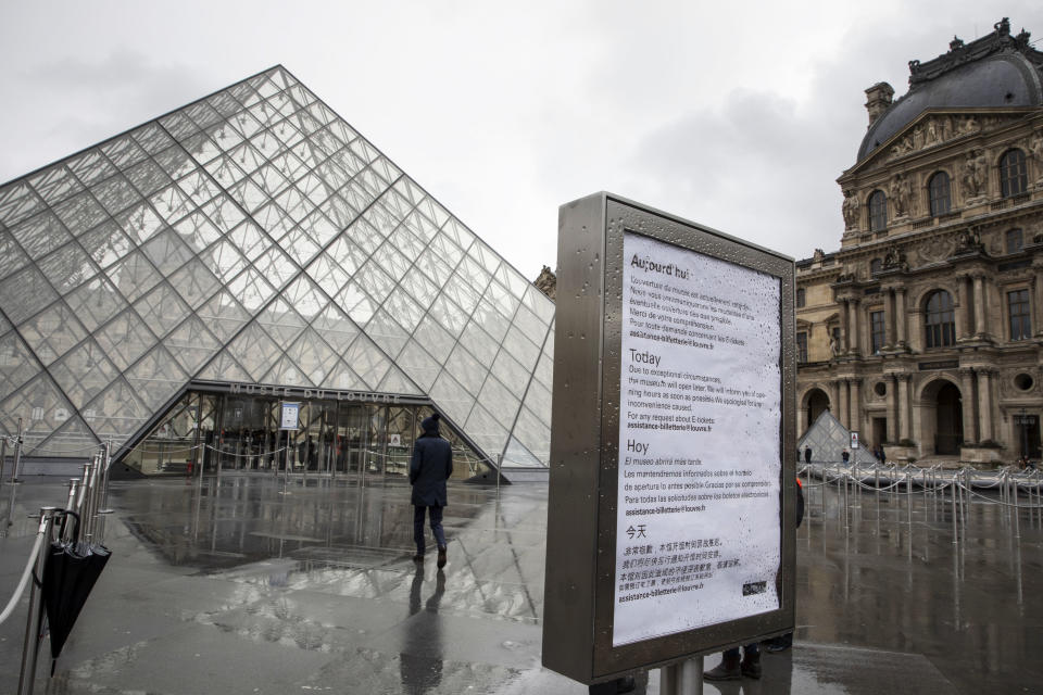 A sign advising of the closure of Louvre Museum due to staff worries over the coronavirus outbreak sits on display outside the tourist attraction in Paris, France, on Monday, March 2, 2020. (Adrienne Surprenant/Bloomberg via Getty Images)