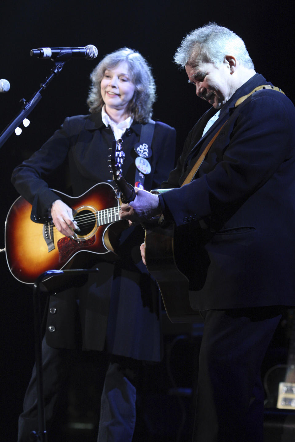 FILE - Nanci Griffith, left, and John Prine perform at the Americana Music Association awards in Nashville, Tenn., on Sept. 17, 2009. Griffith, the Grammy-winning folk singer-songwriter from Texas whose literary songs like “Love at the Five and Dime” celebrated the South, has died. She was 68. A statement from her management company on Friday, Aug. 13, 2021, confirmed her death, but no cause of death was provided. (AP Photo/Josh Anderson, File)